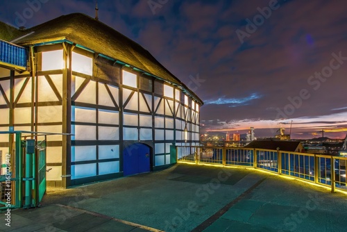 Illuminated Globe Theater at Sunset Showcasing London’s Architectural Beauty. Generative AI photo