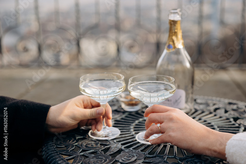Wallpaper Mural Elegant Hand with Engagement Ring and Champagne Glasses on Ornate Table Torontodigital.ca