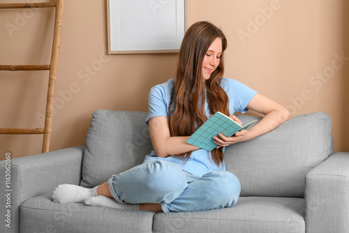 Young woman relaxing on sof...
