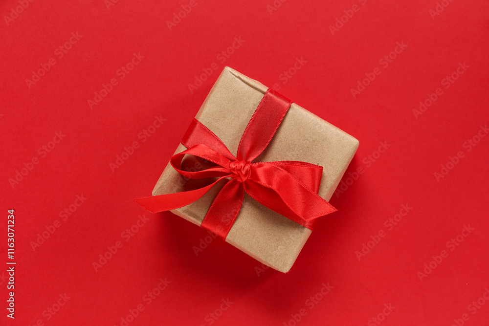 Gift box with ribbon on red background. Valentine's Day celebration Gift box with ribbon on red background. Valentine's Day celebration