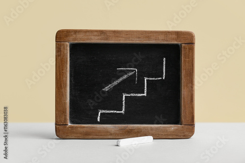 Chalkboard with drawn ladde...
