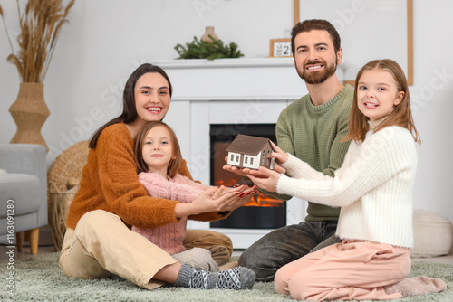 Young family with model of ...