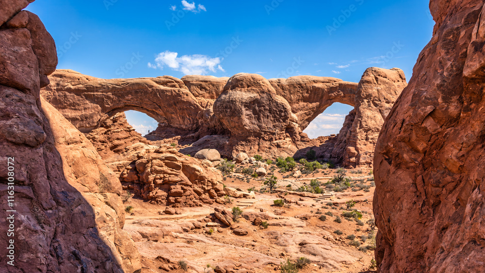 Fototapeta premium The Windows in Arches National Park, Utah. Also known as the Spectacles, these two arches stand side by side, cut from the same sandstone fin. A large nose separates the Spectacles