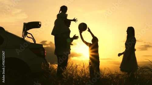 Father mother child play with ball rays sun laugh joyfully. Happy family playing with ball near car sunset. childhood dream trip. kid with parents picnic forest. silhouette happy family with children