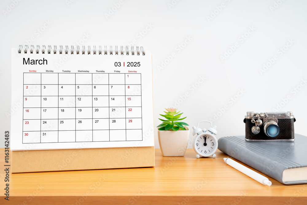 Naklejka premium Desktop Calendar for March 2025 year and vintage camera with diary for Planner to plan timetable.