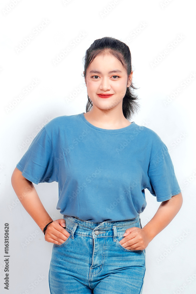 Portrait of a confident smiling girl standing on white background
