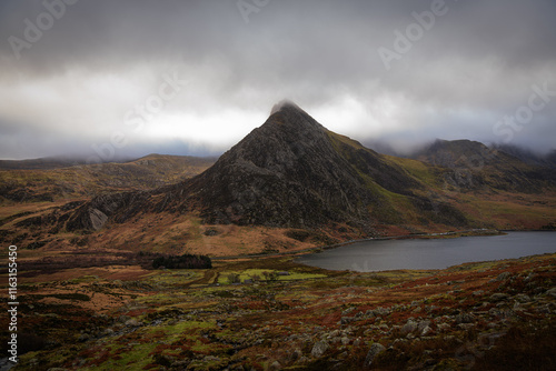 Tryfan peak emerging from the clouds in Snowdonia National Park photo