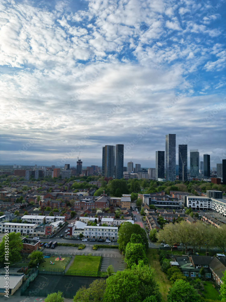 Obraz premium Aerial View of Buildings at Greater Manchester Central City, Northwest of England, United Kingdom. Aerial View Footage Was Captured with Drone's Camera on May 4th, 2024 During Sunset Time.