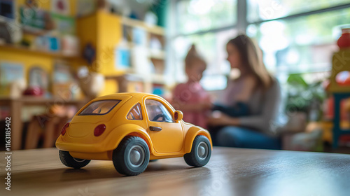 Close up of toy car in playroom background, mother and daughter living together photo