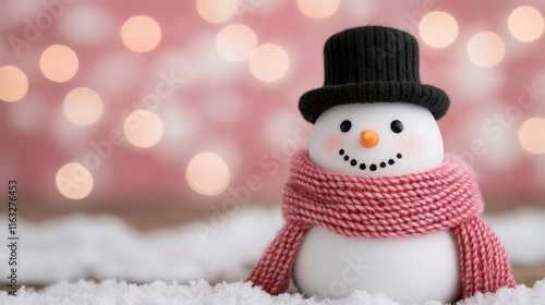 A cheerful snowman wearing a black hat and a pink scarf stands on a snowy surface, with a soft bokeh background of warm lights, evoking a cozy winter holiday atmosphere.