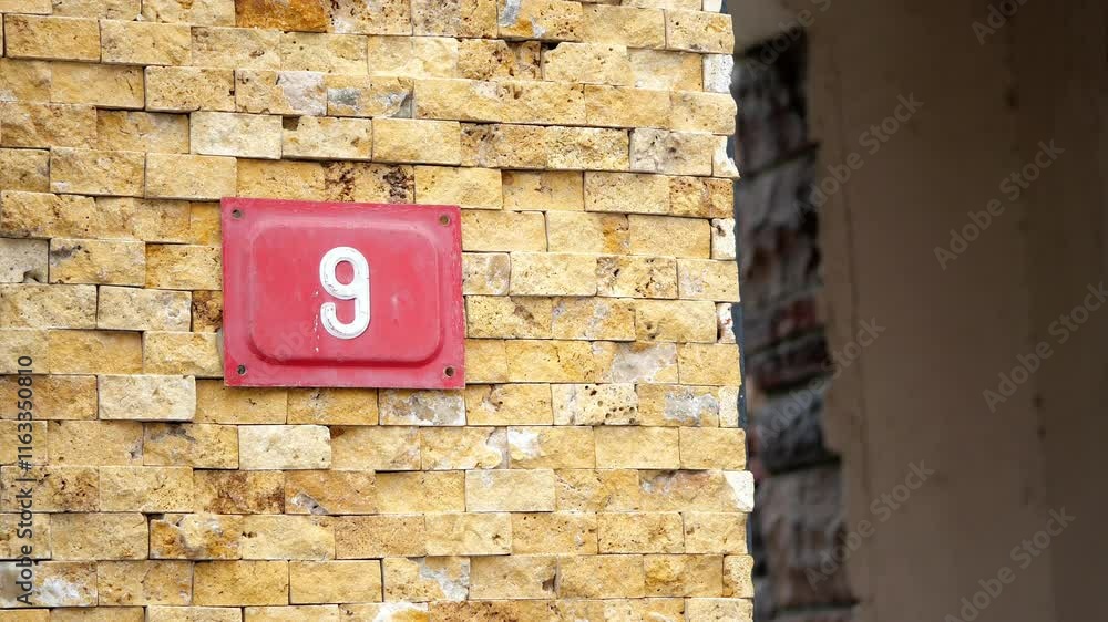 A Charming Entrance Featuring the Number 9 on a Beautiful Rustic Wall A Charming Entrance Featuring the Number 9 on a Beautiful Rustic Wall