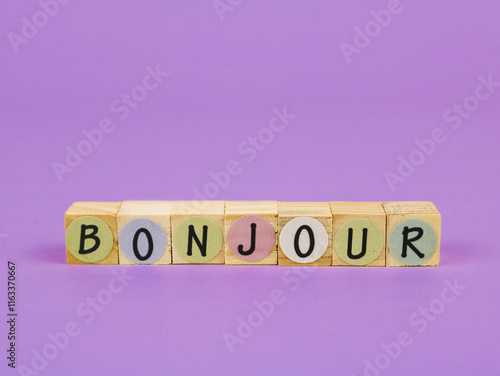 Inscription the words Bonjour, translate in english is congratulation. Arranged on wooden word blocks photo