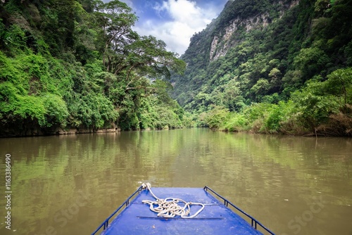 A boat travelling on Ba Be Lake in Ba Be National Park in Bac Kan Province, Vietnam photo