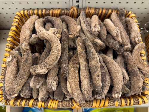 A view of a basket full of dried sea cucumber, on display at a local Chinese health food store. photo