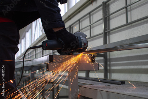 worker cutting steel