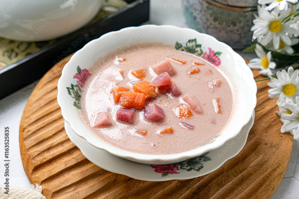 Bubur Cha Cha is a creamy coconut dessert with colorful cubes of purple, orange, and white sweet potatoes and yam. A traditional Southeast Asian dessert, particularly popular in Malaysia and Singapore Bubur Cha Cha is a creamy coconut dessert with colorful cubes of purple, orange, and white sweet potatoes and yam. A traditional Southeast Asian dessert, particularly popular in Malaysia and Singapore