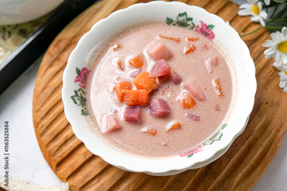 Bubur Cha Cha is a creamy coconut dessert with colorful cubes of purple, orange, and white sweet potatoes and yam. A traditional Southeast Asian dessert, particularly popular in Malaysia and Singapore Bubur Cha Cha is a creamy coconut dessert with colorful cubes of purple, orange, and white sweet potatoes and yam. A traditional Southeast Asian dessert, particularly popular in Malaysia and Singapore