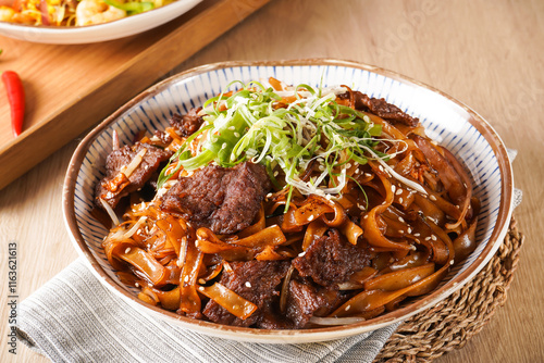 Stir fried Beef River with Swiss Sauce served in bowl isolated on napkin side view of hong kong food on wooden background