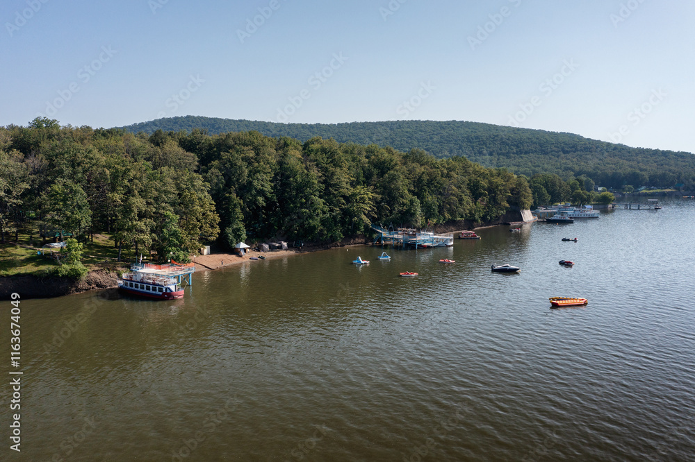 Southern Urals, Bashkortostan, camp sites on the shore of the Nugush reservoir. Aerial view. Southern Urals, Bashkortostan, camp sites on the shore of the Nugush reservoir. Aerial view.