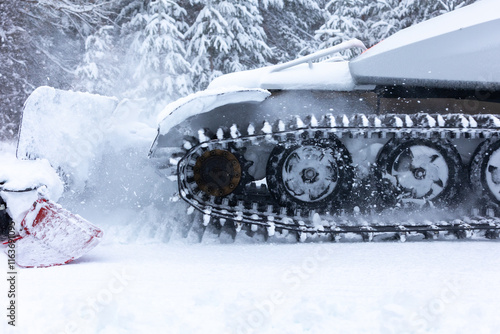 Snow groomer ratrack machine close-up, ski slope photo