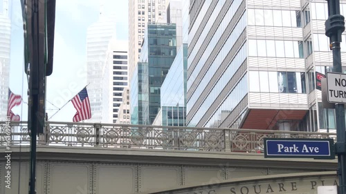 New York City Grand Central Terminal, 42 street, Park Avenue, Pershing Square bridge architecture. Midtown district railroad hub, railway transport. American flag, NY crossroad, intersection road sign
