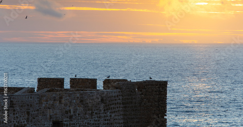 Sunset over the Atlantic above the Safi fortress in Morocco photo