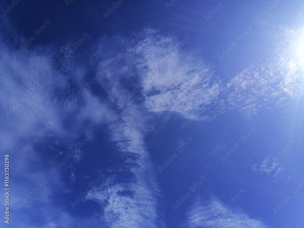 Interesting cloud pattern in blue sky, nature background Interesting cloud pattern in blue sky, nature background
