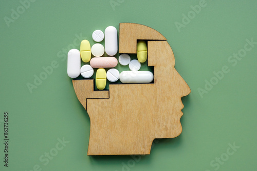 Картината върху платно Head model with parts replaced by pills. Mental health treatment.