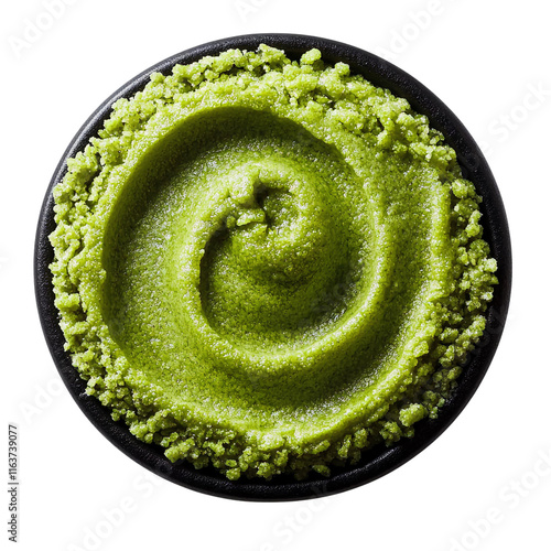 Photos green wasabi paste in black bowl, top view