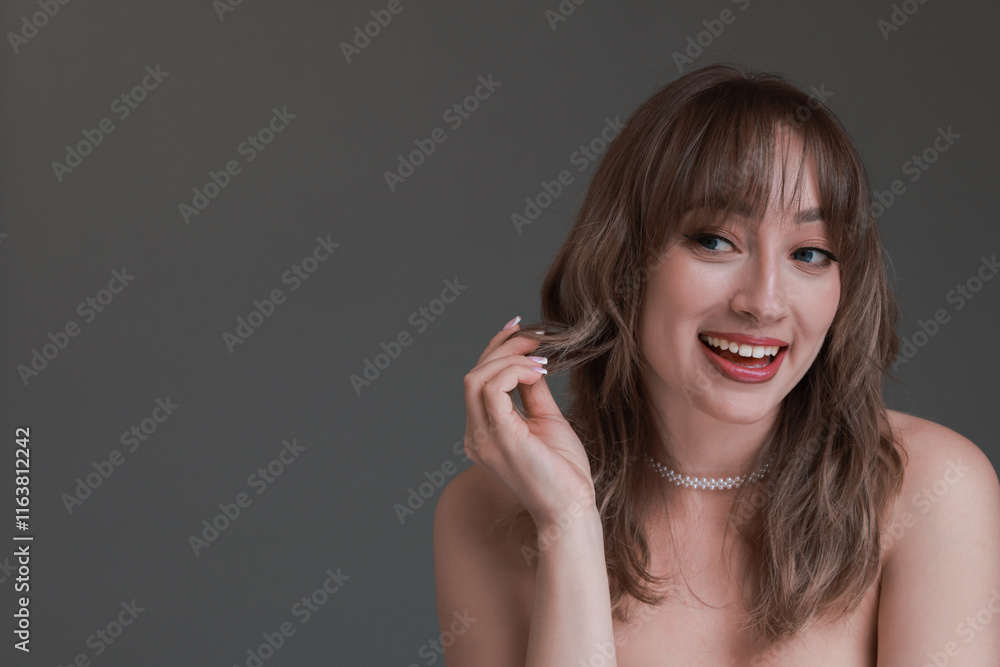 Attractive woman with stylish haircut on grey background, space for text Attractive woman with stylish haircut on grey background, space for text
