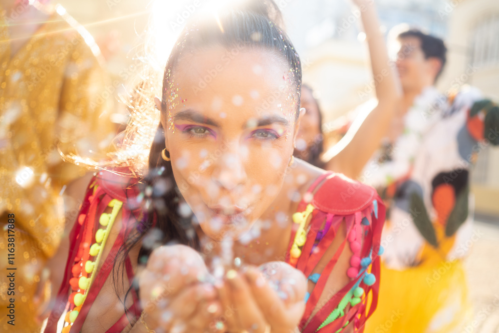 Confetti blow in the street of happy Carnival party. Brazil traditional festival abstract blurred background..