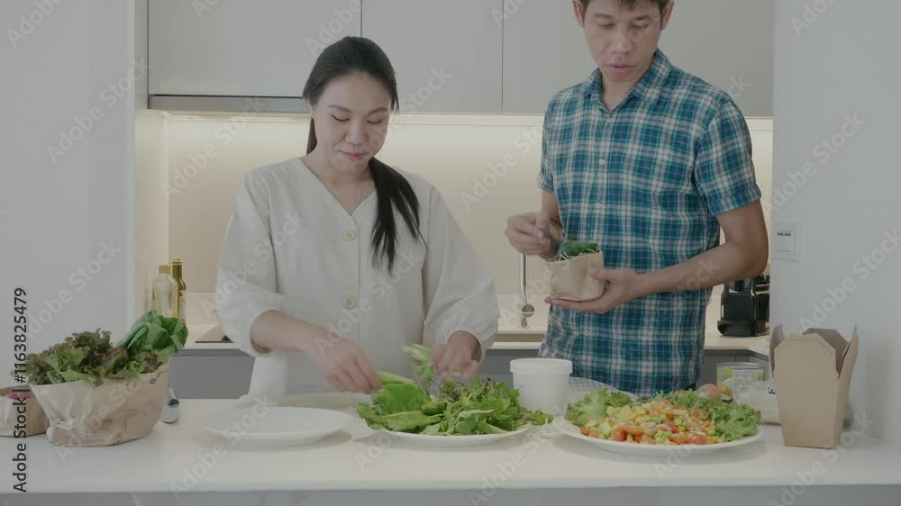 A woman and a man are preparing a meal together in a kitchen. The woman is cutting vegetables while the man is standing nearby. The atmosphere is warm and inviting A woman and a man are preparing a meal together in a kitchen. The woman is cutting vegetables while the man is standing nearby. The atmosphere is warm and inviting