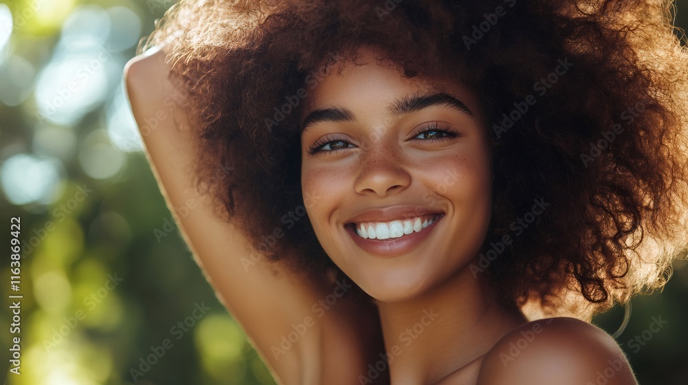 Beautiful young woman with afro hair smiling in nature Beautiful young woman with afro hair smiling in nature