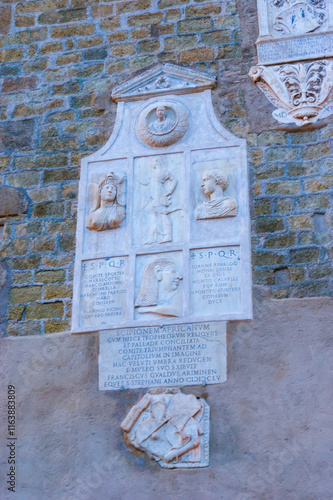 The ancient Roman plaque on the wall of Palazzo Senatorio dedicated to Scipio Africanus, Rome, Italy photo