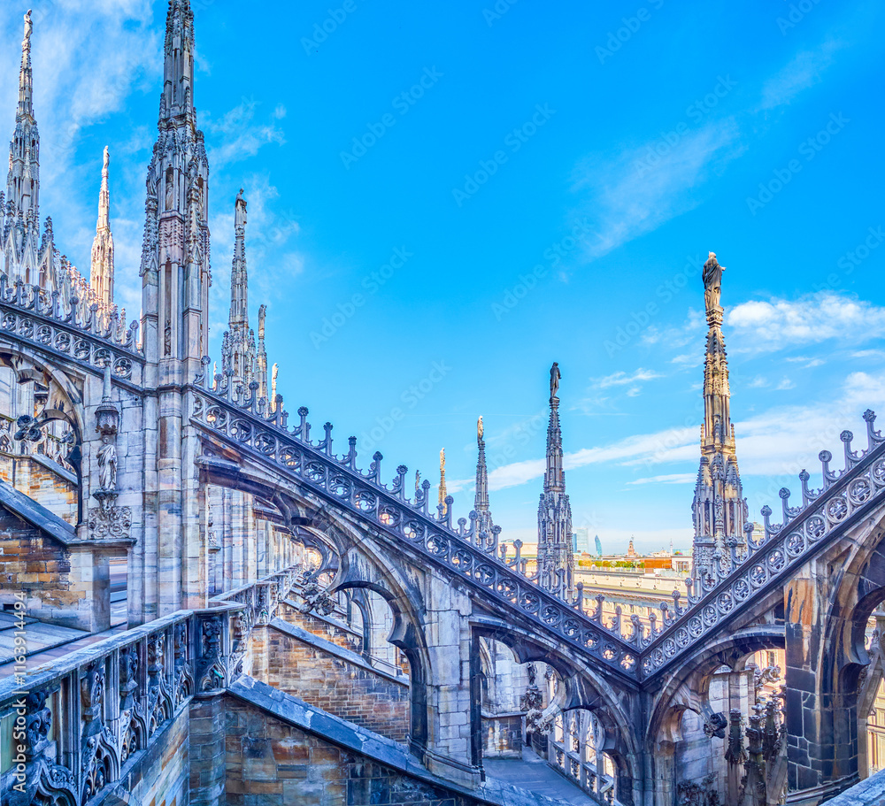 Flying buttresses in Gothic style on the roof of Milan Cathedral, Italy