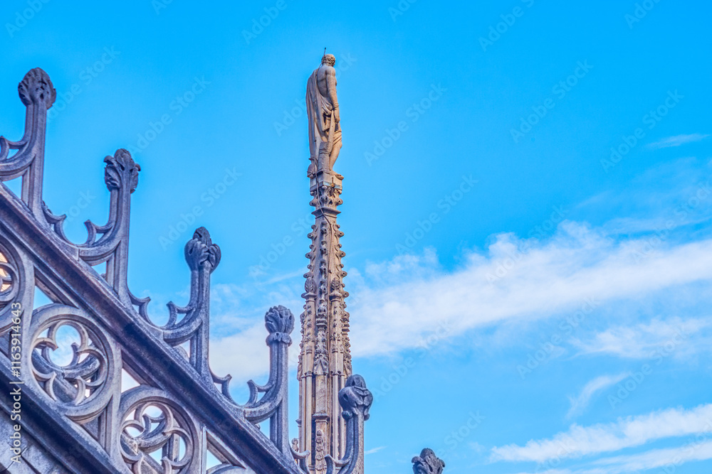 Statues of saints, angels, and religious figures on the spires of Milan Cathdral, Italy