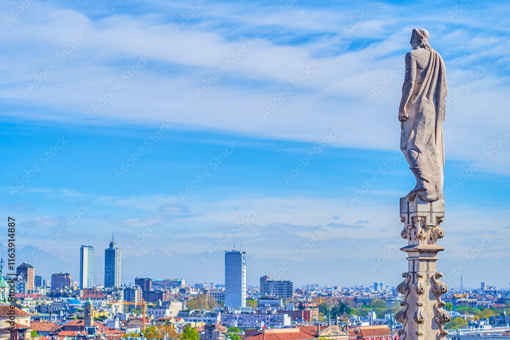 Statues of saints, angels, and religious figures on the spires of Milan Cathdral, Italy