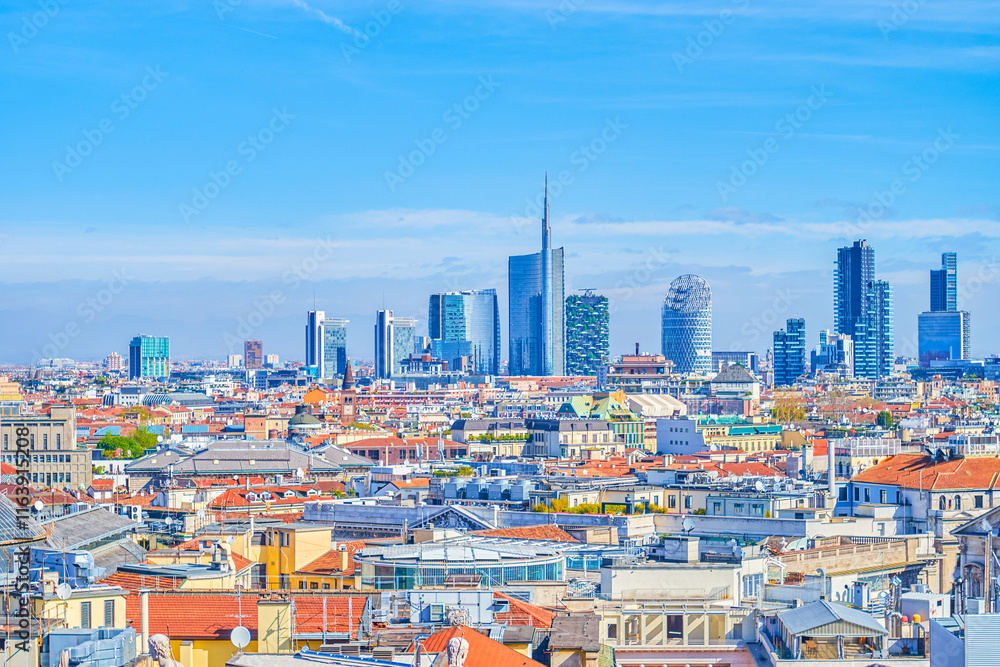 The roofs ofhistoric buildings and the Milan Financial District in the background, Italy.