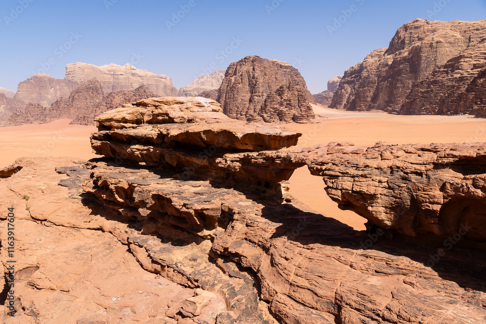Wadi Rum, Jordan: The little arch in the dramatic desert landscape of the Wadi Rum area in Jordan in the middle east.
