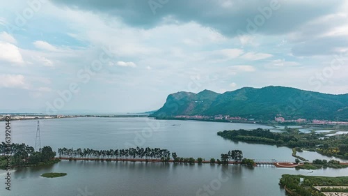 Explore breathtaking aerial time lapse of Kunming West Mountain and Dianchi Lake showcasing nature's beauty in stunning detail photo