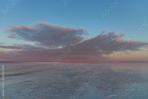 Beautiful sunrise on the Elton salt lake. Volgograd region, Russia photo