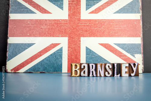 BARNSLEY. Urban Area in Great Britain. Flag and alphabet letters on wooden texture background photo