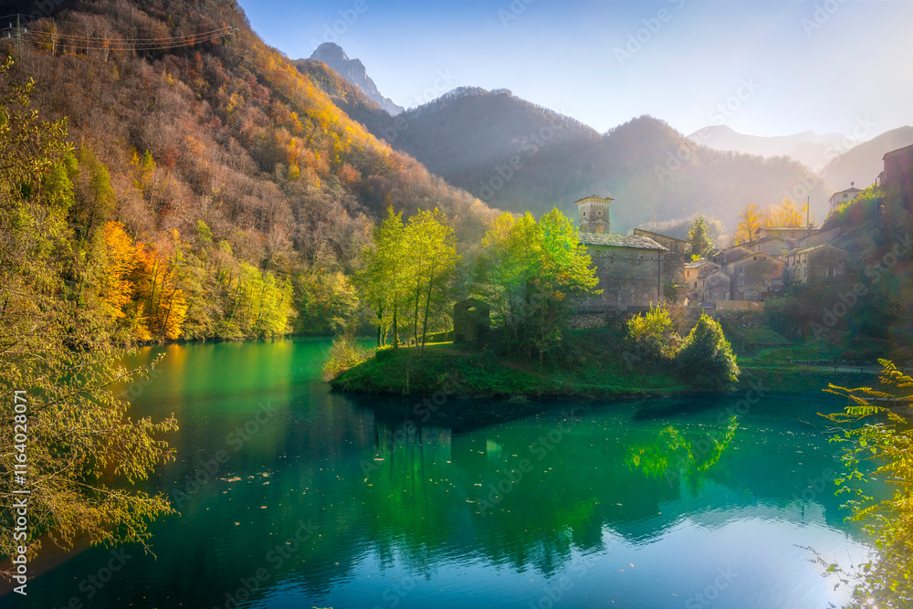 Isola Santa medieval village and lake in autumn foliage. Garfagnana, Tuscany, Italy. Isola Santa medieval village and lake in autumn foliage. Garfagnana, Tuscany, Italy.