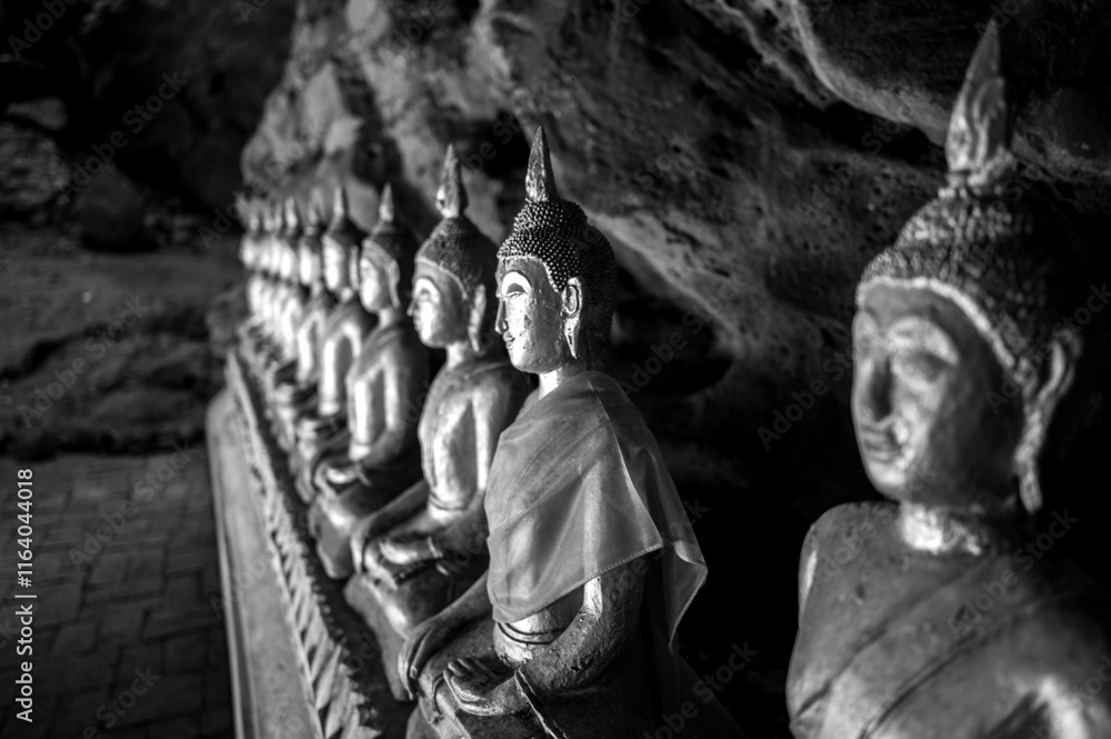 Statue of Buddha in Buddhism Cave in Thum Khao Luang in Phetchaburi Province, Thailand