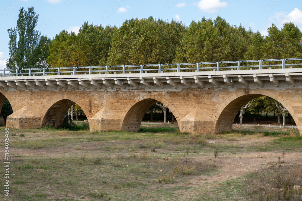 Bridge over the Porma River in the town of Puente Villarente de Villaturiel on the Camino de Santiago in the Province of Leon