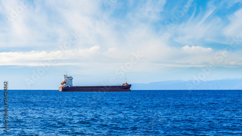 oil tanker of russia shadow fleet used for transportation oil in blue sea. Transport for petroleum products, gas and oil under sanctions. photo