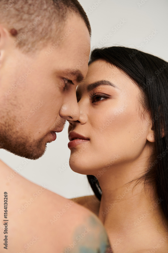 A young couple shares an intimate moment in a studio, celebrating love on Valentines Day. A young couple shares an intimate moment in a studio, celebrating love on Valentines Day.