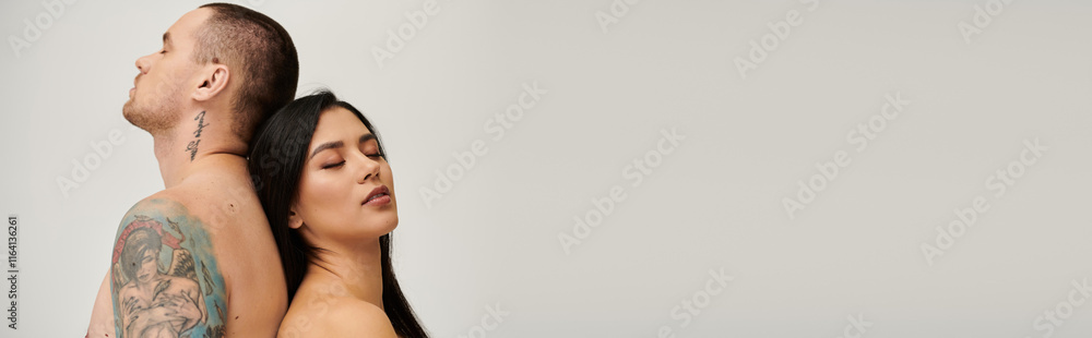 Young couple shares an intimate moment in a studio setting, expressing love and passion, banner Young couple shares an intimate moment in a studio setting, expressing love and passion, banner