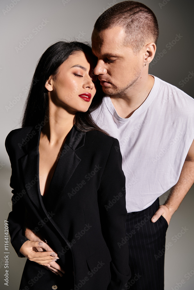 A beautiful couple enjoys a romantic moment in a chic studio, dressed for Valentines day. A beautiful couple enjoys a romantic moment in a chic studio, dressed for Valentines day.