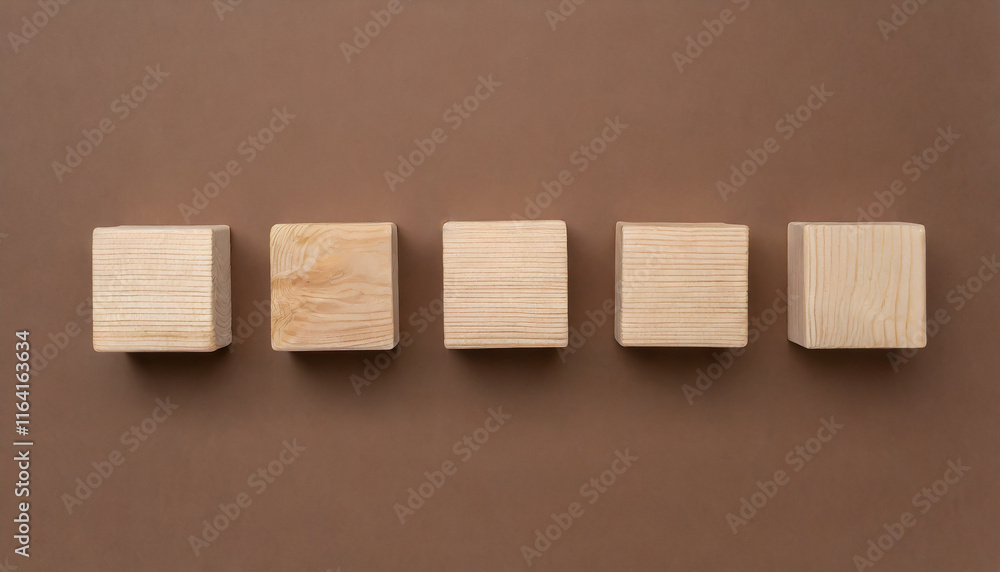 5 wooden cubes on brown surface. Wood blocks. Flat lay. Place for adding text or design. 5 wooden cubes on brown surface. Wood blocks. Flat lay. Place for adding text or design.